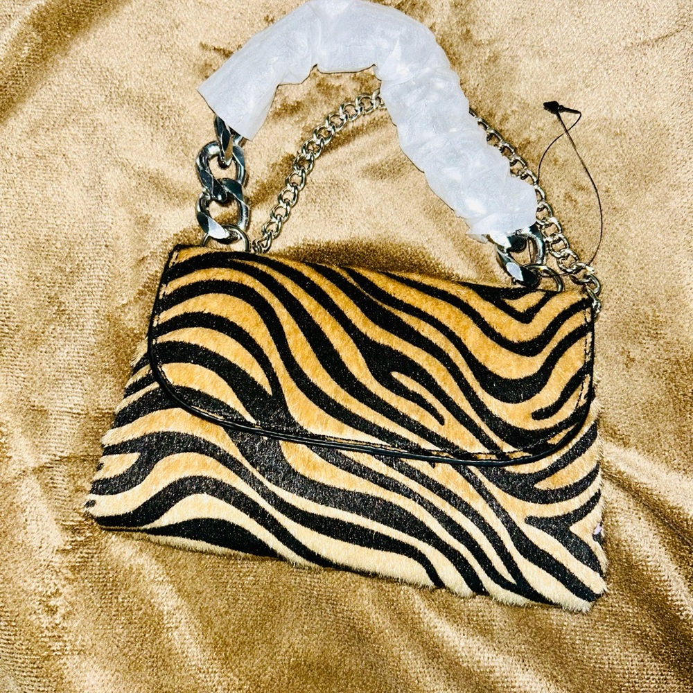 Small evening bag. Tan and black zebra print.